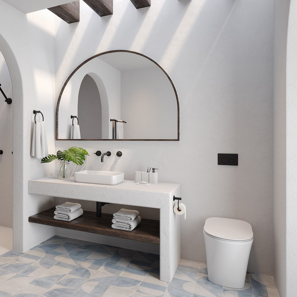 Raymor white wall faced rimless toilet with slim seat in a modern bathroom beside vanity and mirror