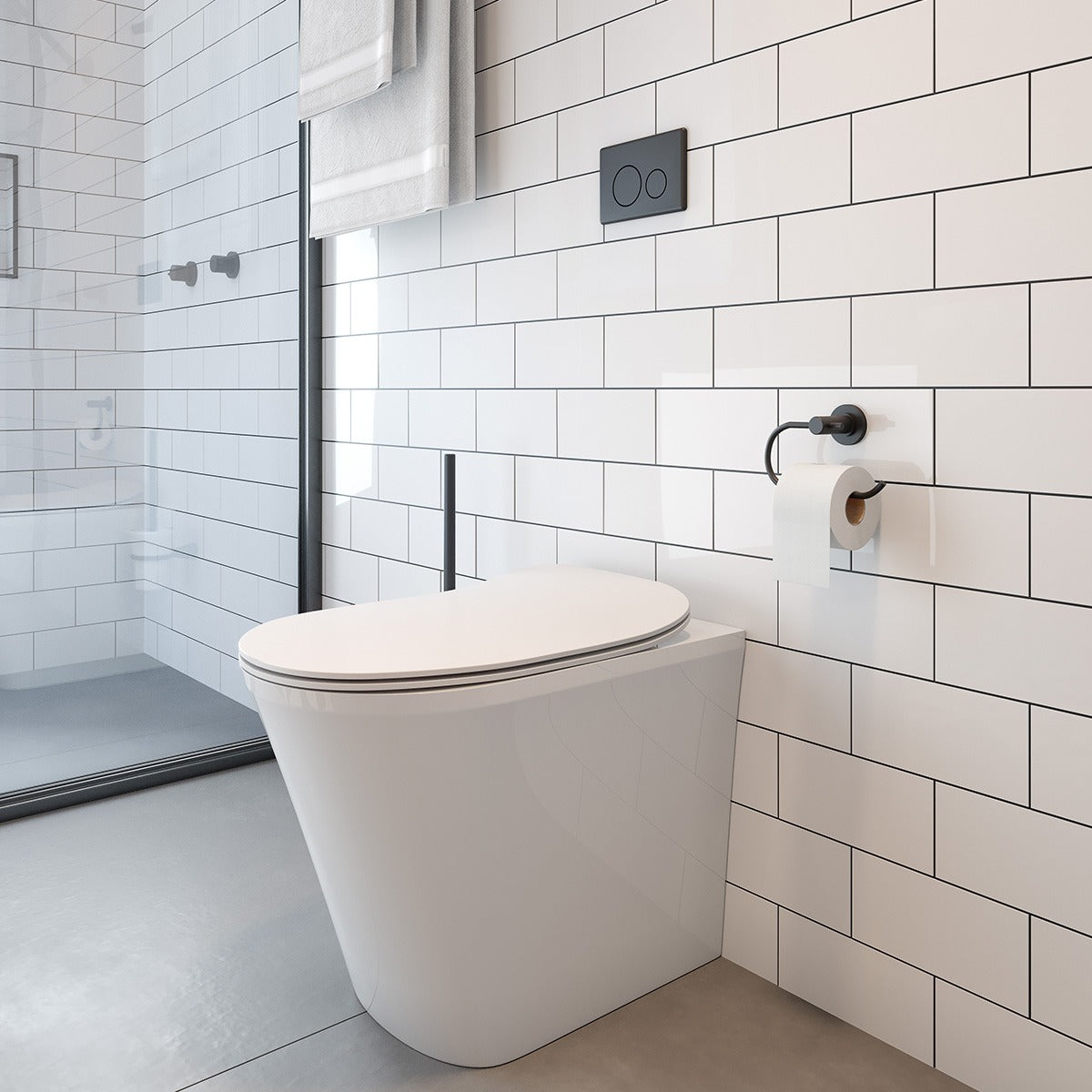 Raymor Edge II white wall-faced rimless toilet with slim seat in a modern tiled bathroom, front angle
