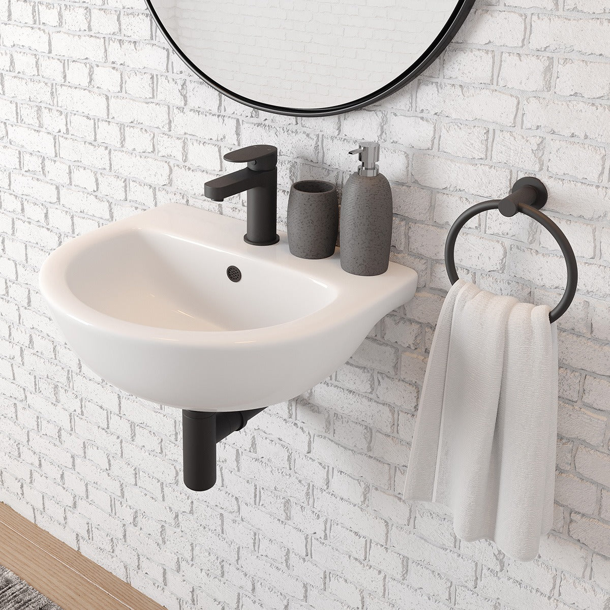 Raymor Lawson wall hung basin in white ceramic, arch shape, shown with black mixer on a brick wall bathroom setting.