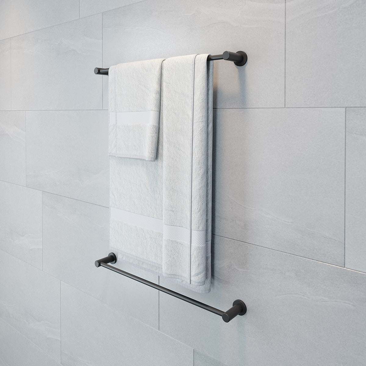Raymor Projix black single towel rail mounted on light grey tiled bathroom wall, with towel hanging above a lower rail