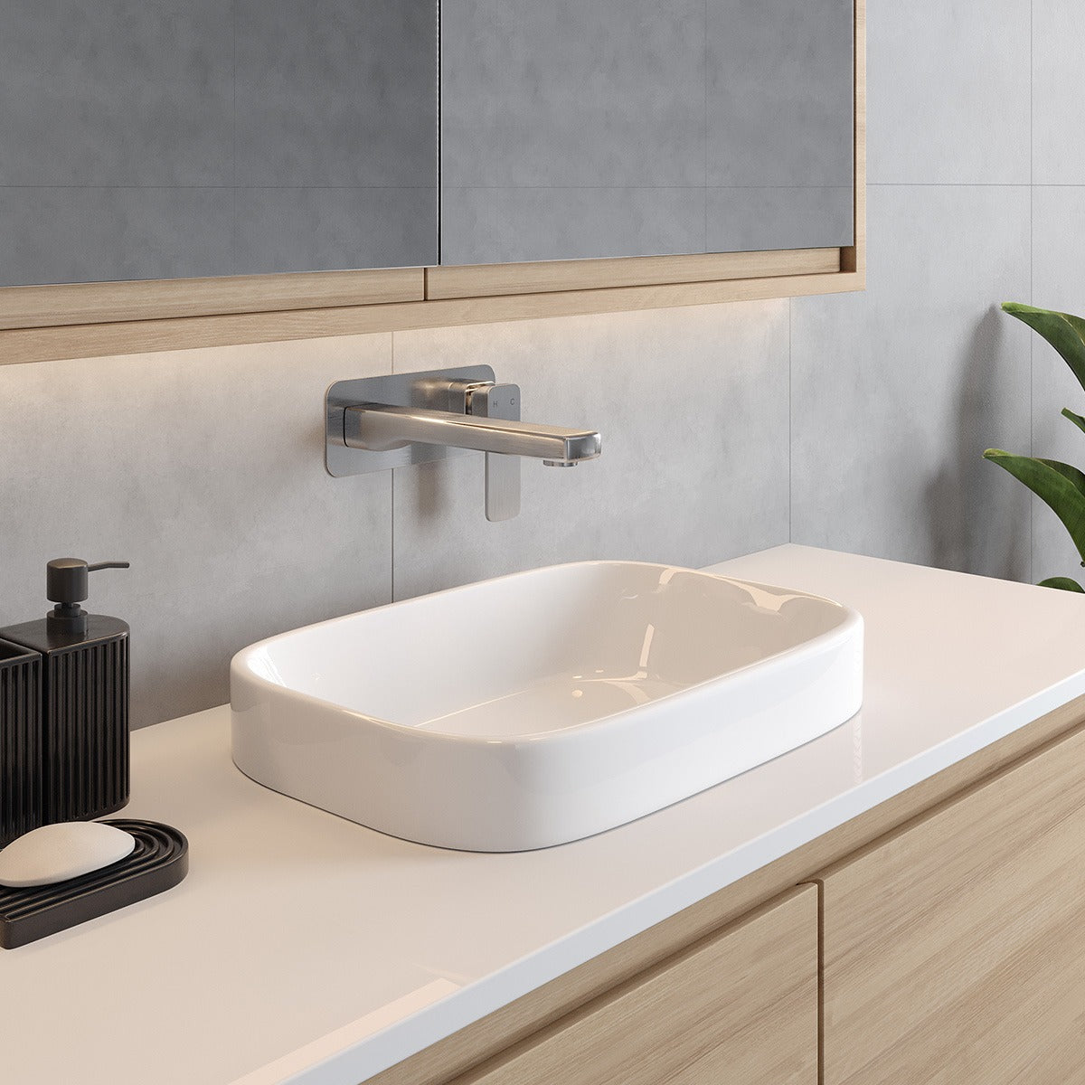 White Raymor Sigma inset basin on a vanity top, rectangular rounded-square ceramic sink in a modern bathroom setting