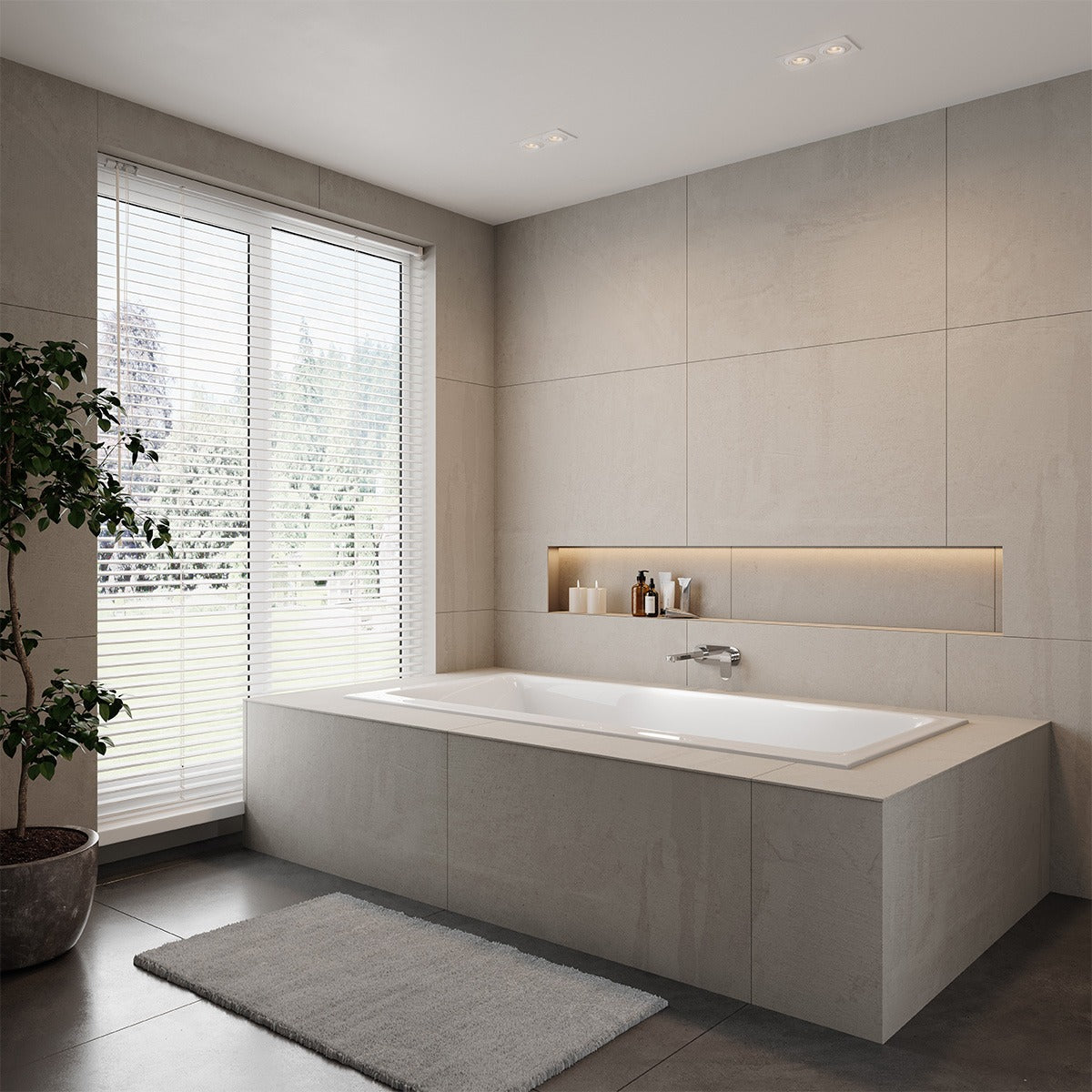Raymor Winton white island bath in a tiled hob bathroom, with centre waste and exposed rim by a window