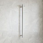 Thermogroup brushed stainless round vertical single bar heated towel rail on a tiled bathroom wall