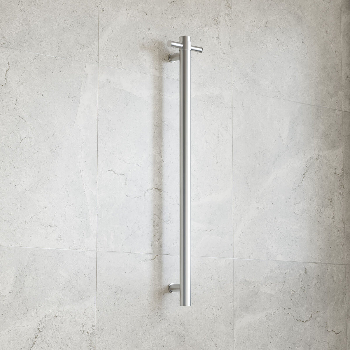 Thermogroup brushed stainless round vertical single bar heated towel rail on a tiled bathroom wall