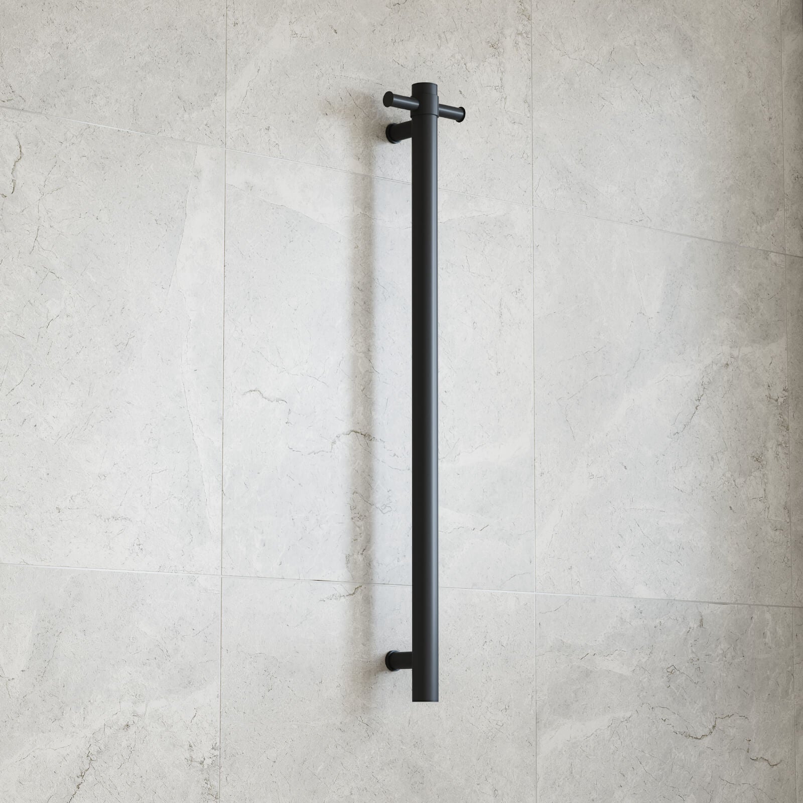 Thermogroup matte black round vertical single-bar heated towel rail mounted on a light tiled bathroom wall
