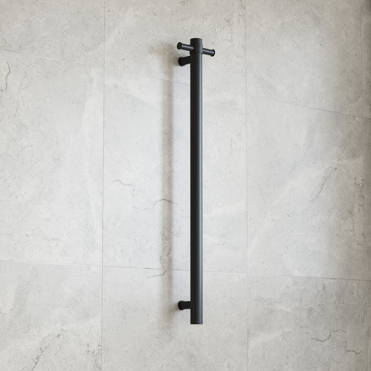 Thermogroup matte black round vertical single-bar heated towel rail mounted on a light tiled bathroom wall