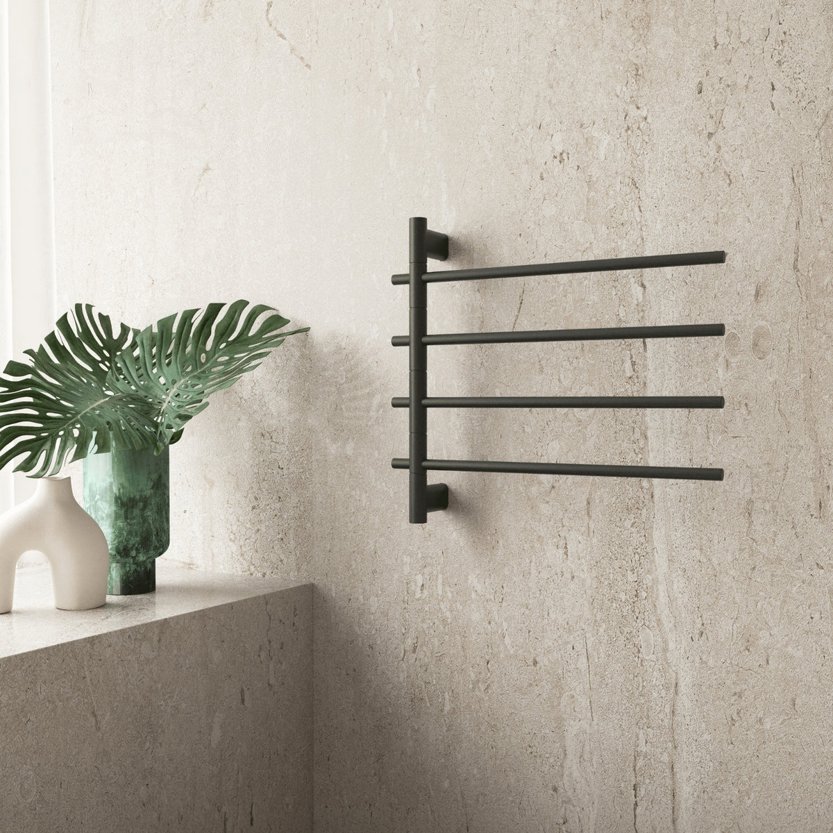 Thermogroup matt black heated towel rail with 4 swivel bars, wall-mounted in a bathroom setting