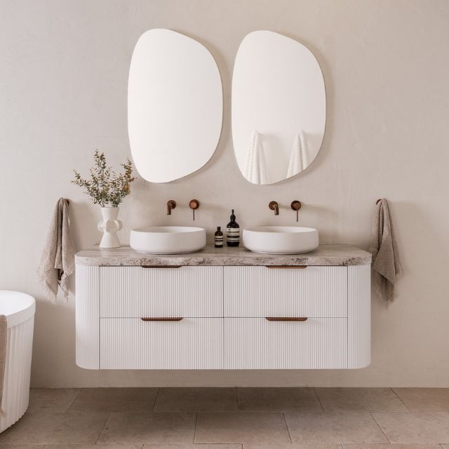 ADP Thirroul wall hung vanity with curved white fluted drawers, grey benchtop and twin round basins in a bathroom setting