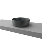 Timberline Allure grey round above-counter basin on a vanity top, shown in side view with a thin rim.