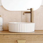 Timberline Allure Flute white round above counter basin, glossy ceramic, with fluted exterior on a timber vanity top