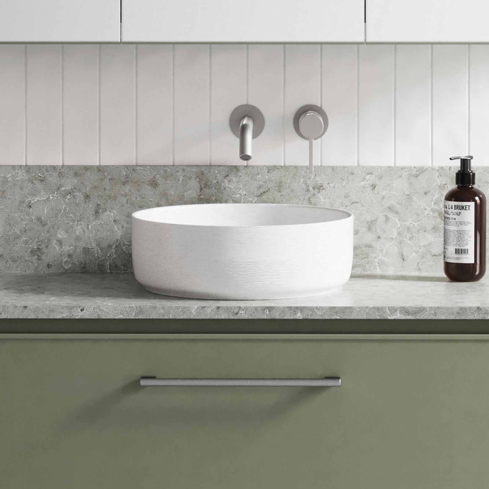 Timberline Allure Raked round above counter basin in white ceramic, shown on a grey vanity with wall-mounted taps