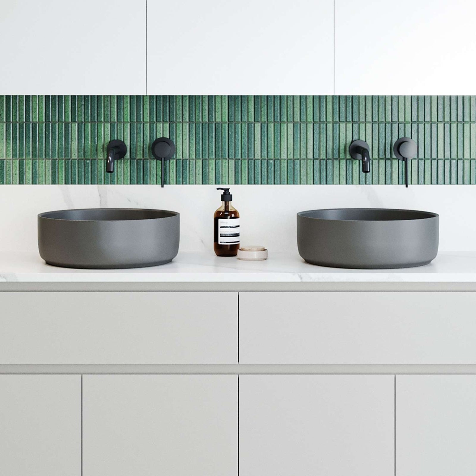 Timberline Anthracite round above-counter basin on a white vanity, shown with twin basins and black tapware in a bathroom setting