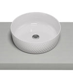Timberline Allure Arrow round white above counter basin with chevron textured outer edge and thin rim, front view