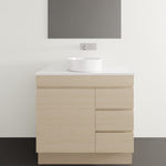 Timberline Bargo floor standing vanity in light woodgrain with white SilkSurface top and round basin, front view