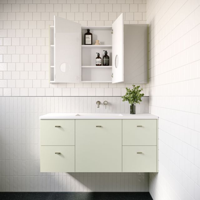 Timberline Carlo wall hung vanity with white Regal basin top and light pistachio cabinet, shown in bathroom setting
