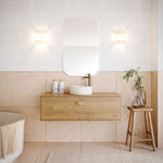Timberline Delaware wall hung vanity in woodgrain finish with round above-counter basin and brass tap in a bathroom setting