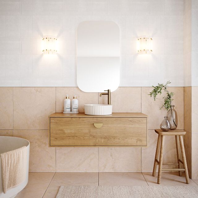 Timberline Delaware wall hung vanity in woodgrain finish with round above-counter basin and brass tap in a bathroom setting
