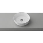 Timberline Gem white round above counter basin on a grey benchtop, with centred waste opening