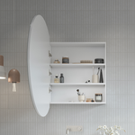 Timberline Havana round shaving cabinet in white, open to show mirror door and shelves against tiled wall