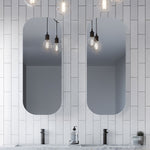 Timberline Jazz Arch Mirror in white satin, shown in a bathroom with two tall arched mirrors above a vanity