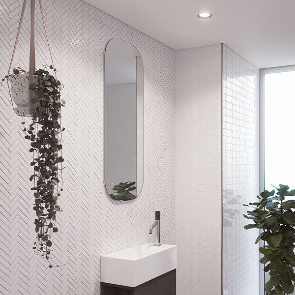 Timberline Jazz Arch Mirror in white satin, tall narrow arched bathroom mirror on patterned wall