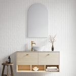 Timberline Kansas wall hung vanity in light woodgrain with above counter basin and open shelves, styled in a bathroom setting