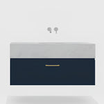 Timberline Kingsley Apollo wall hung vanity in navy blue with white silk surface top and brass handle, front view