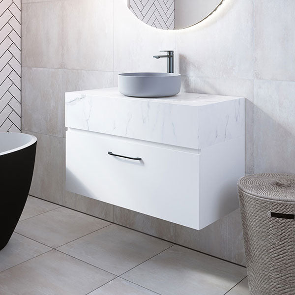 Timberline Kingsley wall hung vanity in white with marble-look box top and round above counter basin in bathroom setting
