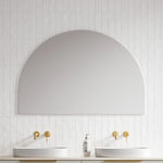 Timberline Melody half-moon mirror in white satin finish, wall hung above twin basins in a bathroom setting