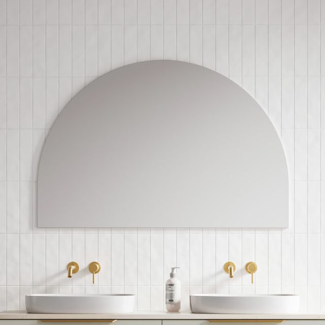 Timberline Melody half-moon mirror in white satin finish, wall hung above twin basins in a bathroom setting