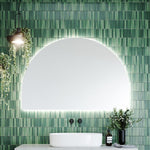Timberline Melody arch mirror with soft curved shape and white satin edging, mounted above a bathroom vanity with LED glow surround