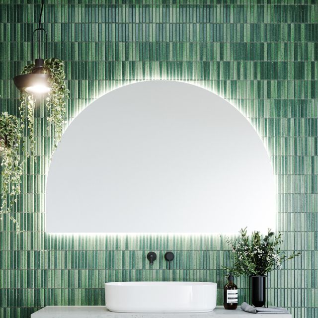 Timberline Melody arch mirror with soft curved shape and white satin edging, mounted above a bathroom vanity with LED glow surround