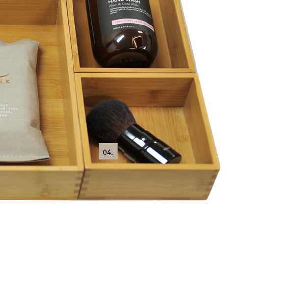 Timberline bamboo modular drawer organiser box in natural finish, shown in a vanity drawer with compartments for small items