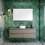 Timberline Nevada Plus wall hung vanity in woodgrain finish with white above counter basin in green tiled bathroom