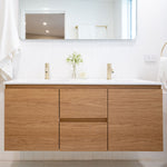 Timberline Nevada wall hung vanity in Tasmanian oak finish with white acrylic top, front view in bathroom