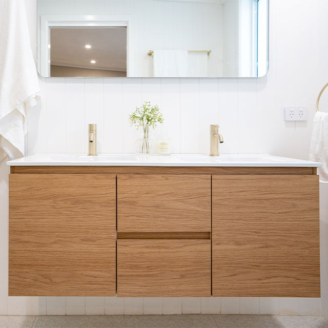 Timberline Nevada wall hung vanity in Tasmanian oak finish with white acrylic top, front view in bathroom