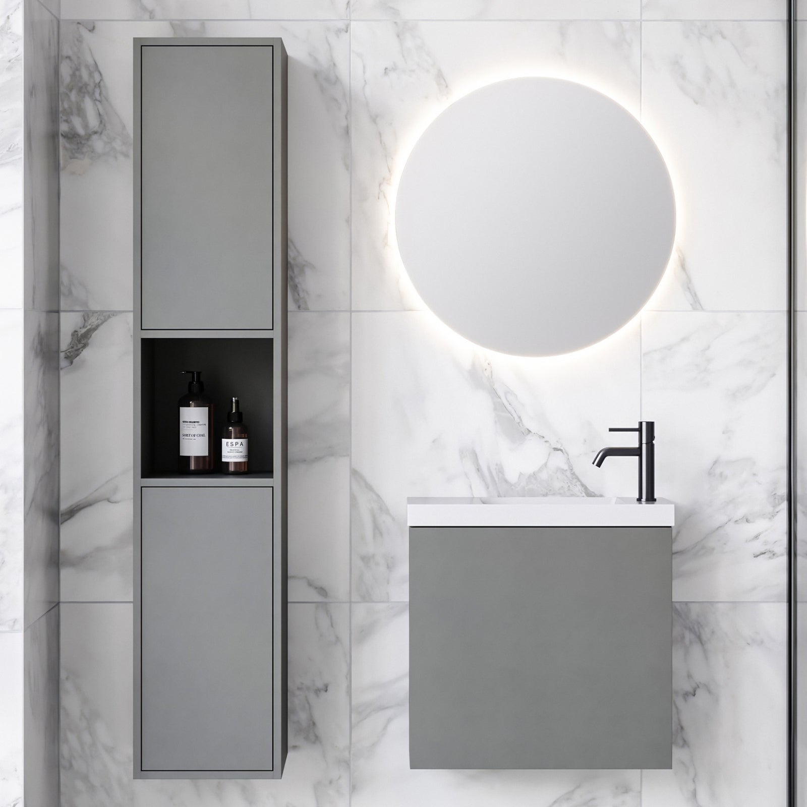 Timberline Ollie wall hung vanity in grey with white top, shown in a modern bathroom with round mirror and black tapware