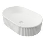 Timberline Oval Flute above-counter basin, matte white ceramic, oval with fluted sides and thin rim