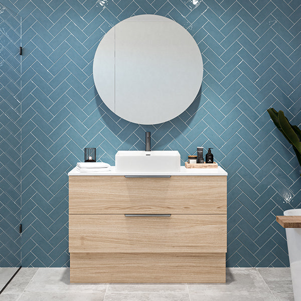 Timberline Oxbow freestanding vanity in woodgrain finish with white stone top and basin, front view