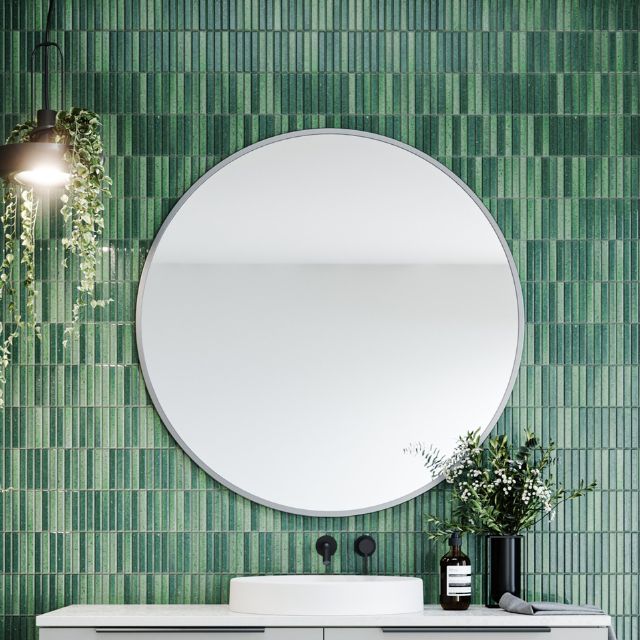 Timberline Portland round wall mirror with slim white frame, styled above a bathroom vanity against green tile