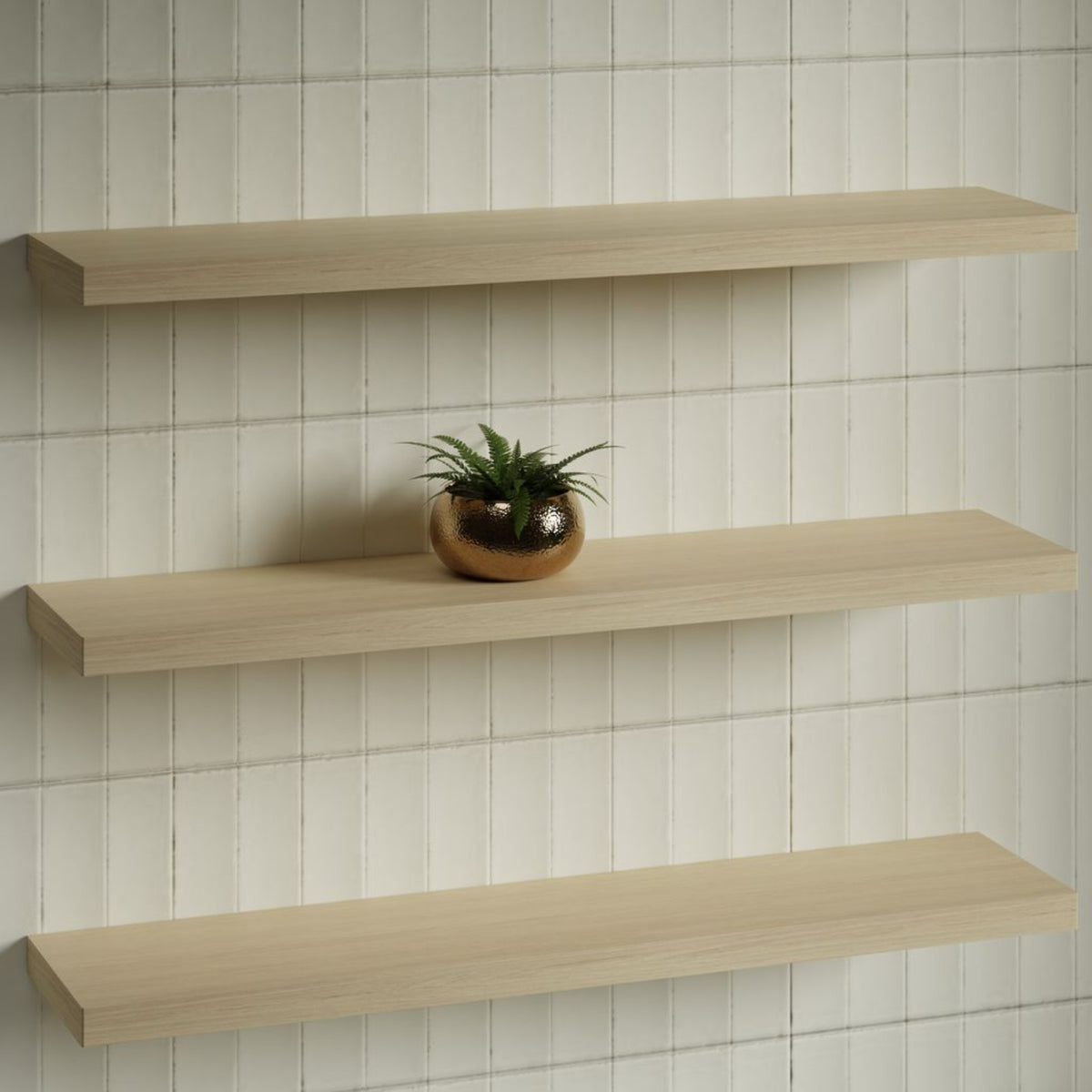 Timberline Splice wall shelf in light woodgrain, shown mounted on a tiled bathroom wall with hidden fixings.