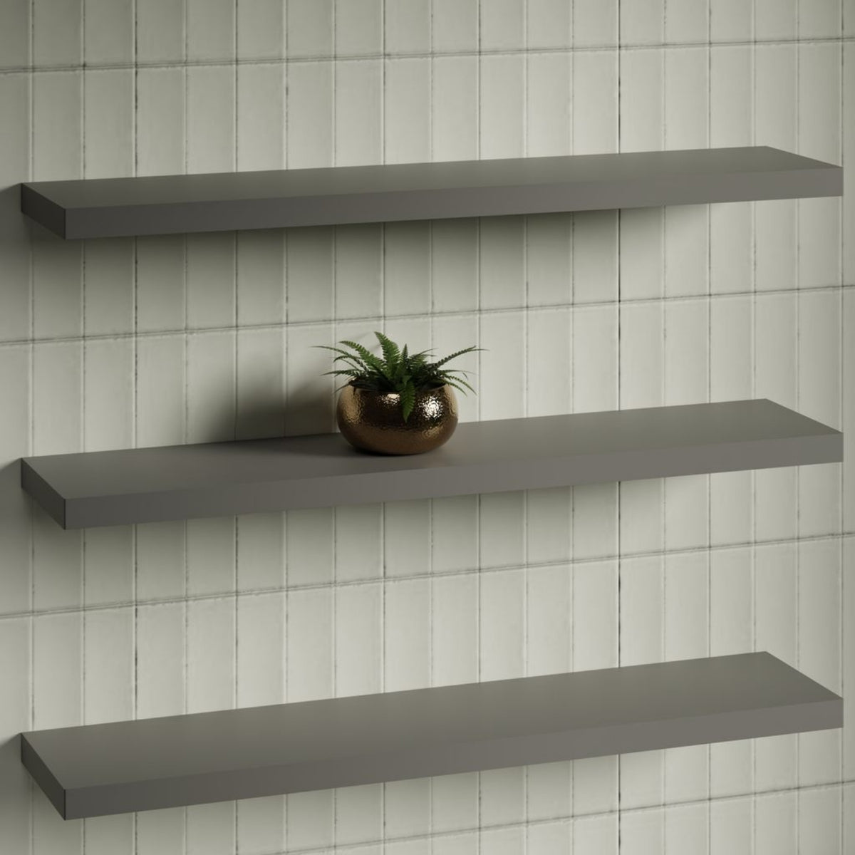 Timberline Splice Shelf wall-mounted bathroom shelf in grey, shown in three stacked views on a tiled wall, one with a plant.