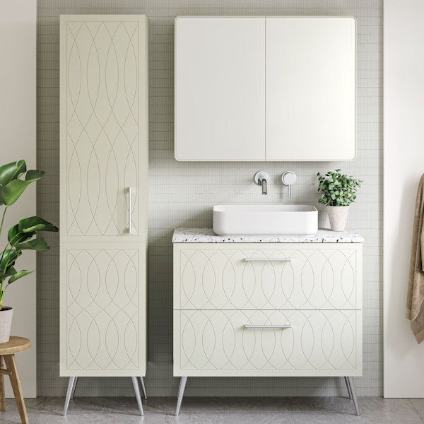 Timberline Sutherland House Deco white vanity with drawer fronts, freestanding on metal legs, shown in a bathroom setting