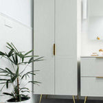 Timberline Sutherland House Deco floor-standing storage cabinet in white, with patterned doors and gold legs, in bathroom setting