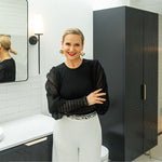 Timberline Sutherland House Deco Storage Cabinet in black, floor-standing, with double doors in a bathroom setting