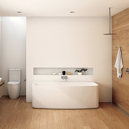 Toilet, back-to-wall bath, overhead shower, and wall-mounted towel holder against a white & wooden backdrop with wooden flooring
