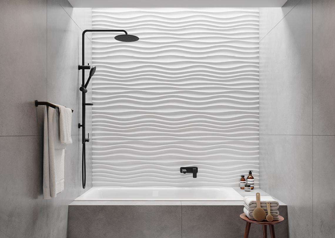 Compact bathroom with textured white feature wall, black rail shower and inset bath