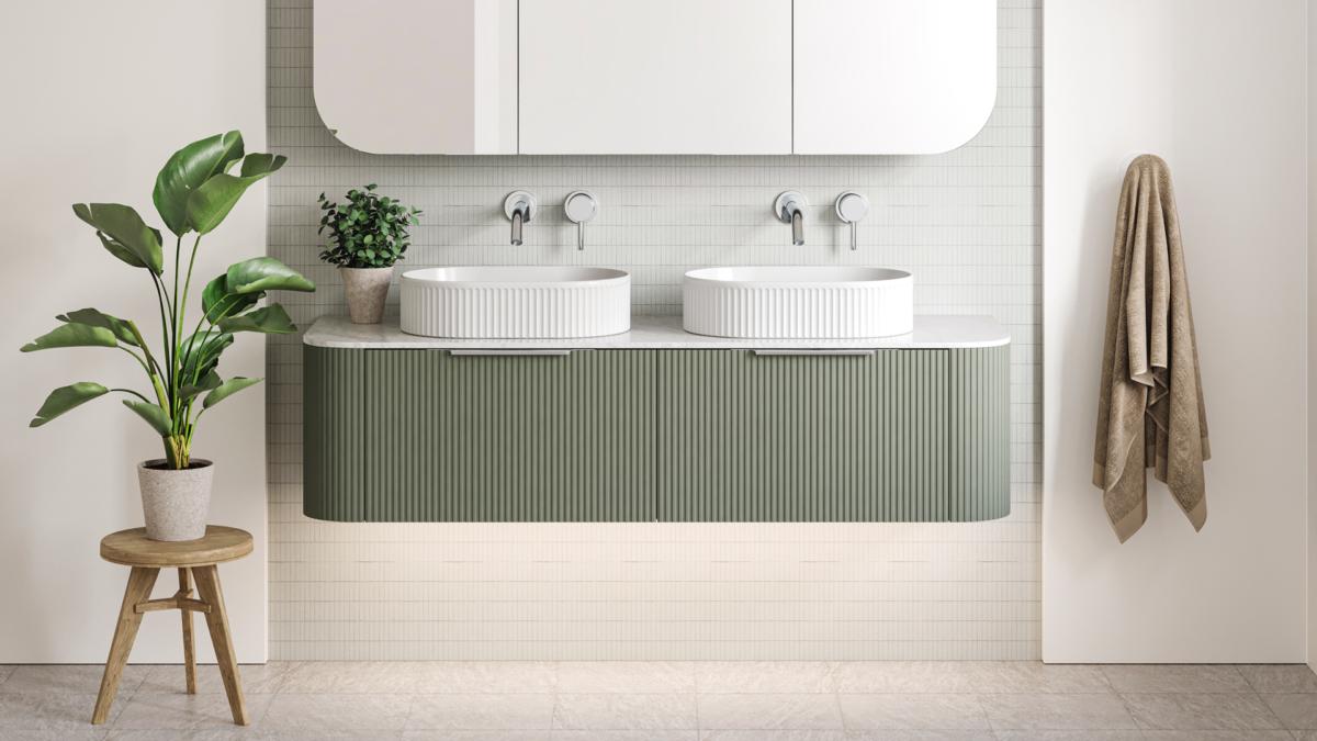 Sage green Timberline Santos Dockland fluted vanity with twin basins and Raymor Projix chrome wall mixers