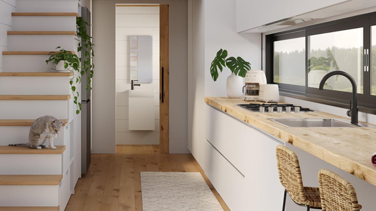 Compact tiny house kitchen with timber bench, black gooseneck mixer and small sink