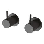 Phoenix Vivid Slimline wall top assemblies in matte black, shown as hot and cold wall-mounted taps with slim pin levers